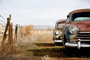 vintage cars abandoned and rusting away in rural wyoming